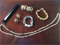 Necklace, stretch bracelets, clip earrings, fan