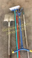 Garden tools shovel  a hoe  a claw and side walk