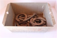 Metal Bin of Horse Shoes and Railroad
