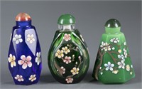 Group of 3 painted glass snuff bottles.