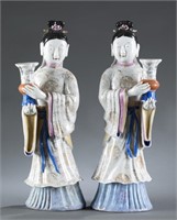 Pair of famille rose maiden candlesticks.