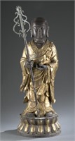 A Chinese bronze monk statue.