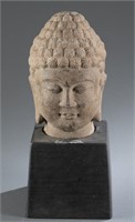 A carved stone Buddha head.