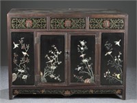 A Chinese hardwood and lacquer sideboard.
