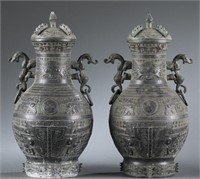 Pair of bronze vessels with lids.