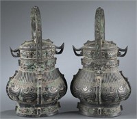 Pair of bronze You vessel with lids.