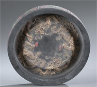 A round Chinese ink cake.
