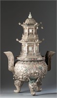 A Mongolian silver pagoda incense burner.