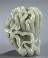 A carved jade Buddha hand.