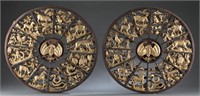 Pair of carved gilt wood zodiac wheels.