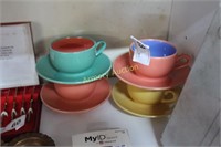 PASTEL COLORED CUPS AND SAUCERS