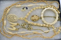 Carved Off White And Shell Jewelry