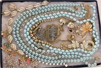 Collection Of Blue Pearls And Gold Jewelry