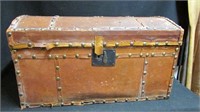 Leather bound tack decorated dome trunk