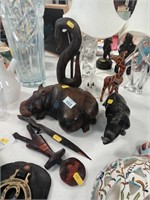 Wooden animal figures including giraffe and rhino