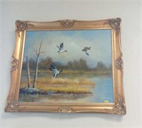 Oil of ducks in gilt frame