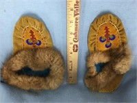Pair of child's leather slippers with beaded decor