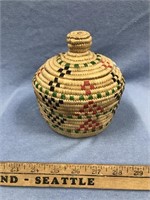 Handmade grass basket with dyed seal gut accents,