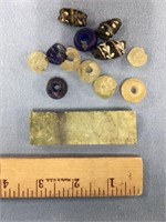 Bag of various trade beads and a piece of soapston