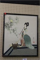 Asian Lady Painting on Canvas
