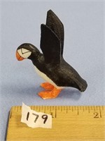 A very unique, ivory carving of a puffin with wing