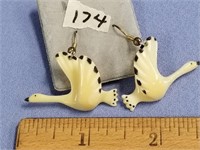 A gorgeous pair of carved fossilized ivory swans i