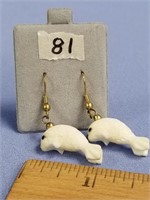 Pair of carved ivory baby seal, dangle earrings, i