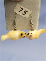 An adorable pair of fossilized ivory dangle, seal