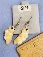 Pair of carved, fossilized ivory, sea otter earrin