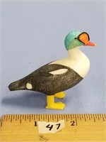 An impressive core ivory carving of a King Eider,