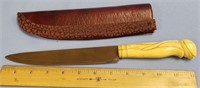An antique fossilized ivory handled knife, abstrac