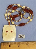 Approx. 13 3/4" long, fossilized ivory and agate