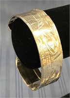 Silver toned cuff bracelet, stamped details of Tli