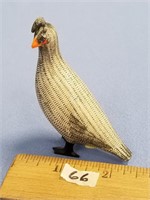 A beautiful carved ivory quail, entirely scrimmed