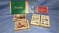 Five sealed packs of Coca-Cola playing cards, one