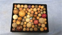 Group of antique play marbles including shooters