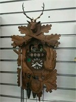 CUCKOO CLOCK, WITH ORNATE CARVING