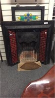 CAST IRON VICTORIAN FIREPLACE INSERT WITH RED