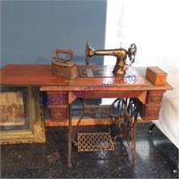 Singer treadle sewing machine in cabinet