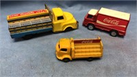 Three toy Coca-Cola trucks,  tin friction truck,
