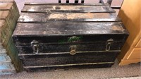 Antique wooden trunk that's been painted black as