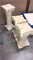 Three ceramic beige pedestals two of them are