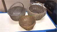Three antique baskets including one large splint