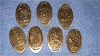 Seven Walt Disney copper penny imprints, (834)