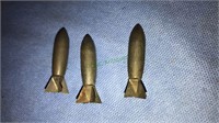 Three World War II some kind a bullet shells,