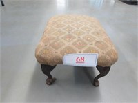 Old cloth covered foot stool