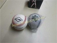 Two leather commemorative baseballs
