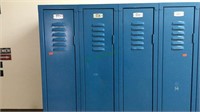 Group of 4 blue steel lockers, No 557-560,