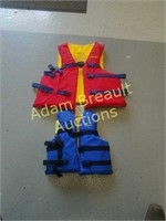 Two Stearns life jackets