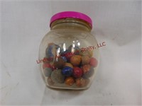 Jar of antique clay marbles